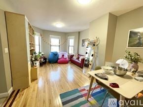Boston apartment for rent - A living room with a wooden floor and a white ceiling.