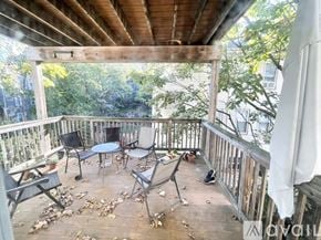 Boston apartment for rent - A wooden deck with a table and chairs.