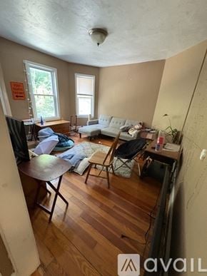 Boston apartment for rent - A living room with a couch, chair, and television.