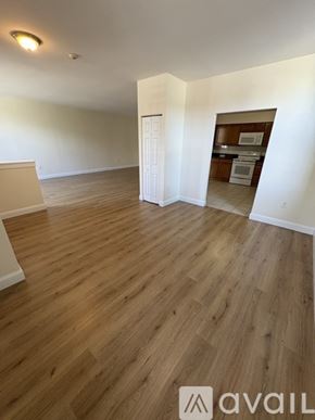 Boston apartment for rent - A room with wooden flooring and a white door.