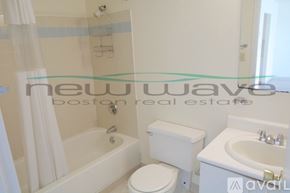 Boston apartment for rent - A white toilet and sink in a bathroom.
