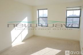 Boston apartment for rent - A room with a window and a carpet on the floor.