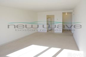 Boston apartment for rent - A white room with a large window and a white floor.