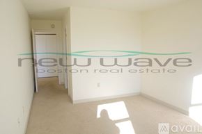 Boston apartment for rent - A room with a white wall and a door is available for rent.