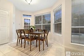 Plano house for rent - A dining room with a table and chairs.