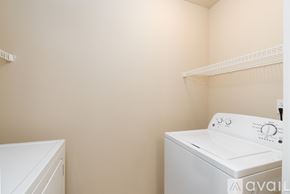 Spokane Valley apartment for rent - A white washing machine in a laundry room.