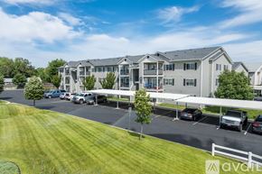 Spokane Valley apartment for rent - A row of houses with a car parked in front of them.