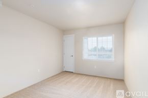 Spokane Valley apartment for rent - A room with a door and a window with a view of trees.