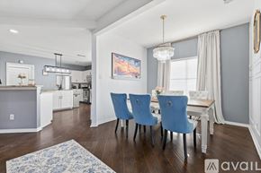 Lewisville house for rent - A dining room with a table and chairs.