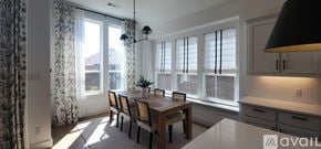 Justin house for rent - A dining room with a table and chairs is available for rent.