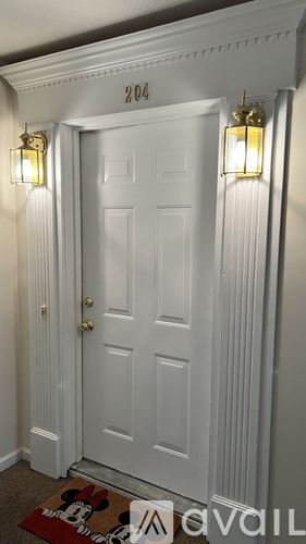 Louisville apartment for rent - A white door with a number 204 above it.