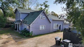 Houston apartment for rent - A kitchen with a black stove top oven and a white refrigerator.