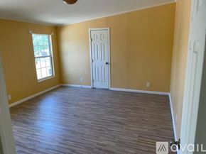 Atascosa apartment for rent - A room with a white door and a window with a view of a tree.