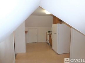 Burlington apartment for rent - A kitchen with white appliances and cabinets.