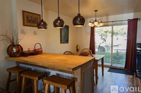 Red Lodge condo for rent - A kitchen with a wooden table and chairs.