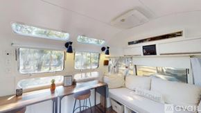 Cat Spring apartment for rent - A white interior of a boat with a bar and a couch.