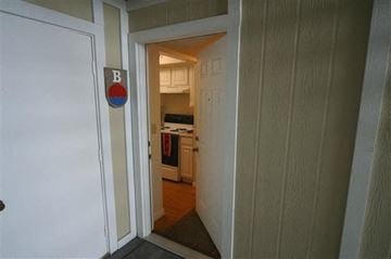 Cincinnati apartment for rent - a doorway to a kitchen with a sign on the door