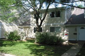 Cincinnati apartment for rent - a white house with a tree in front of it