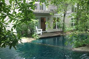 Cincinnati apartment for rent - a house with a swimming pool and a porch