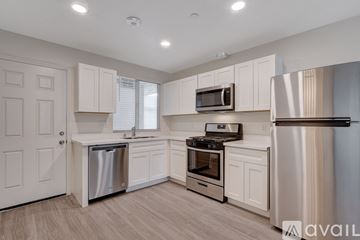 Las Vegas apartment for rent - A kitchen with white cabinets and stainless steel appliances.