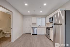 Las Vegas apartment for rent - A kitchen with white cabinets and stainless steel appliances.