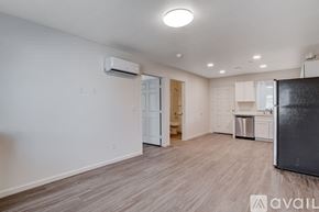 Las Vegas apartment for rent - A kitchen area with a refrigerator, cabinets, and a dishwasher.