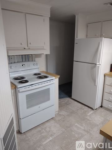 Clearwater apartment for rent - A white kitchen with a stove and refrigerator.