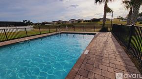 Davenport house for rent - A swimming pool surrounded by a black fence and brick walkway.