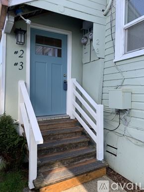 Aberdeen apartment for rent - A blue door with the numbers 2 and 3 on the wall above it.