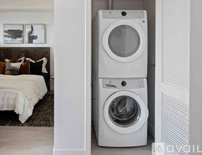 Denver apartment for rent - A white washing machine and dryer in a laundry room.