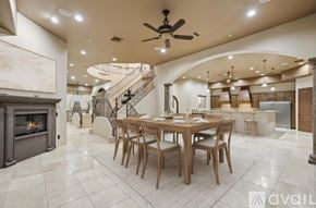 Mesa house for rent - A spacious dining room with a wooden table and chairs.