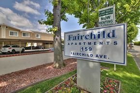 Mountain View apartment for rent - A sign for Fairchild Apartments stands in front of a building.