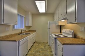 Palo Alto apartment for rent - a kitchen with white appliances and granite counter tops