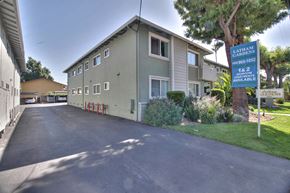 Mountain View apartment for rent - A street view of a residential area with a sign for Latellum Gardens.