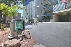 Belmont apartment for rent - A sign for Lake Towers Rental Office is in front of a building.