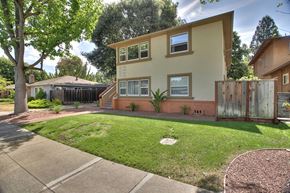 Menlo Park apartment for rent - A building with a brown roof and a white fence.