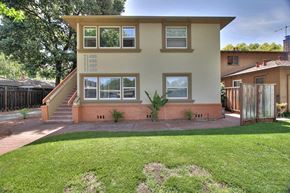 Menlo Park apartment for rent - A building with a green lawn in front.
