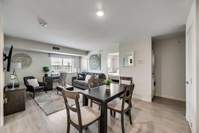 Richardson house for rent - A modern dining room with a dark wood table and chairs.
