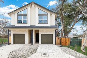 San Antonio house for rent - A modern house with a white exterior and a grey roof.