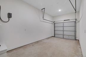 San Antonio house for rent - A garage with a white wall and a white door.