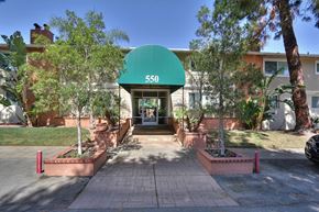 Los Altos apartment for rent - The entrance to apartment building 550 with a green awning.