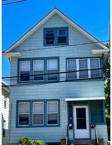 New Brunswick apartment for rent - A two story house with a white door and windows.