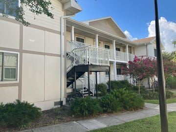Clearwater apartment for rent - A building with a balcony and a staircase.