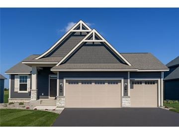 Maple Grove house for rent - A house with a grey roof and a white garage door.