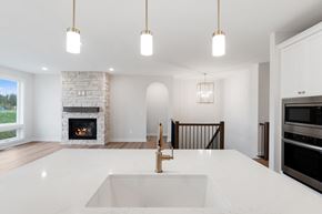 Maple Grove house for rent - A modern kitchen with a fireplace and a sink.