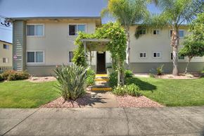 Mountain View apartment for rent - the front of the building with a walkway and plants