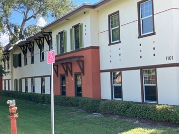 Clearwater apartment for rent - A white building with a red trim and a sign that says NW.