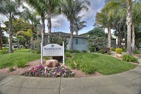 Sunnyvale apartment for rent - a neighborhood sign in front of a house with palm trees