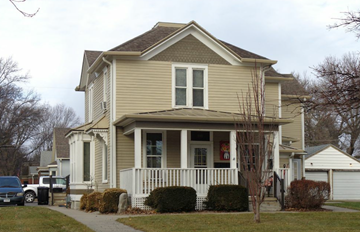 Fremont apartment for rent - A house with a grey roof and a white fence.