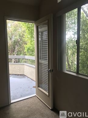 San Diego apartment for rent - A room with a sliding door leading to a balcony.